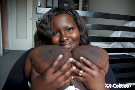 Ebony BBW Mariana Kodjo unleashing her massive tits and playing with them