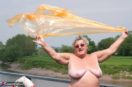 Obese British amateur Grandma Libby casts off a see-through raincoat