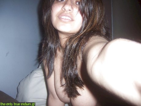 Indian girl removes her headset before taking selfies of her big tits