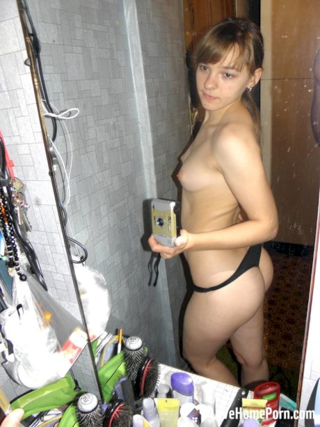 Hot teen with natural tits undresses and takes sexy homemade selfies