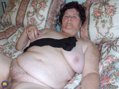 Old BBW Hildegard reveals her big naturals and hairy crotch in her bedroom