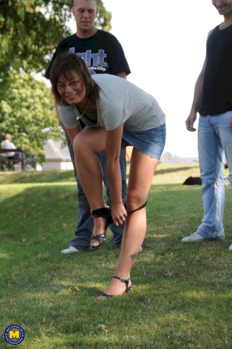 European mature with small tits Lilje gets fucked by two guys in the park