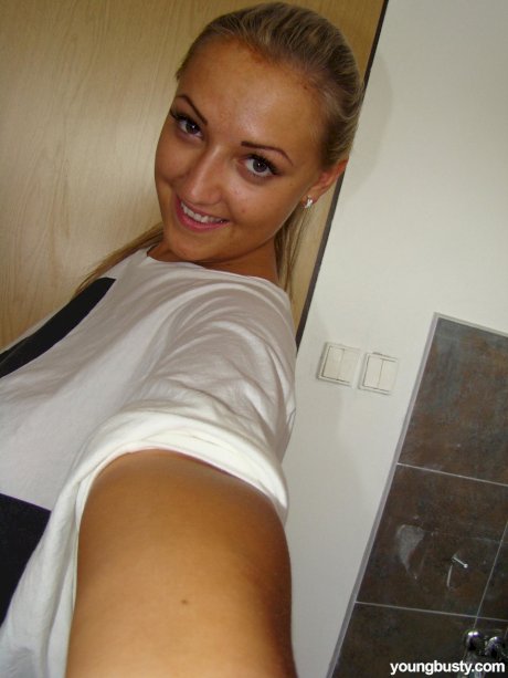 Chubby blonde babe Krystal unveils her huge breasts and shaved vagina