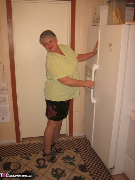 Old woman Girdle Goddess strips to pantyhose in her kitchen