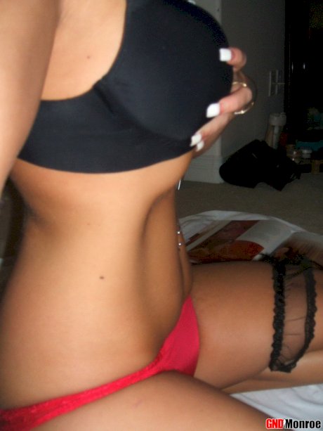 Blonde girl with striking eyes covers her naked body in chocolate sauce