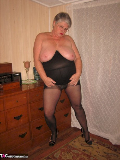 Overweight nan Girdle Goddess strips to her footwear in front of a dresser