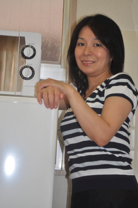 Petite Japanese granny Akiko Oda strips and shows her bushy wet beaver