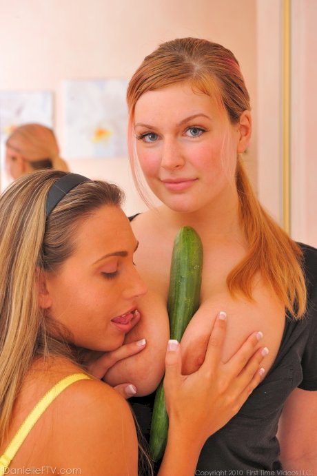 Amateur babes with big tits lick ass and insert cucumber into lesbian cunts