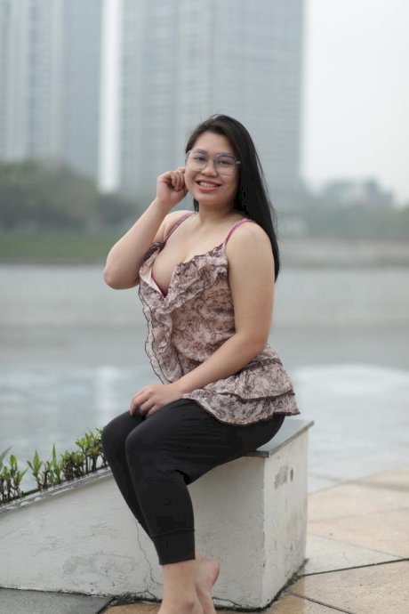 Beautiful chubby babe in glasses teases with her big boobs outdoors