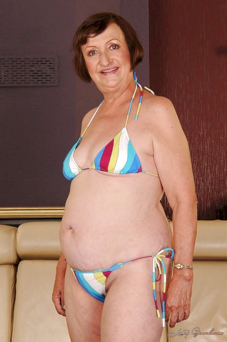 Fatty granny with tiny tits Eve Tickler taking off her bikini