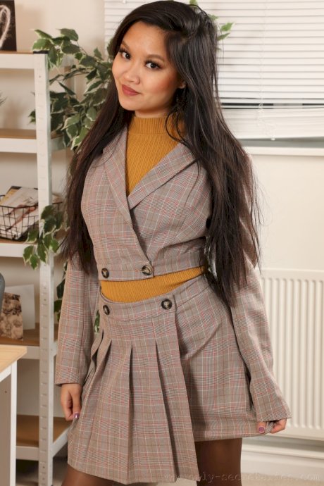 Asian Secretary Louisa Lu displays her small tits while wearing pantyhose