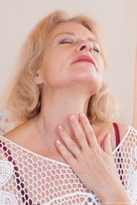 Russian granny Diana Douglas spreading and fingering her fuzzy pussy
