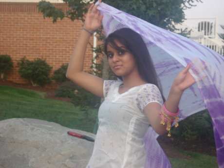 Indian female exposes her big natural tits during candid action at home