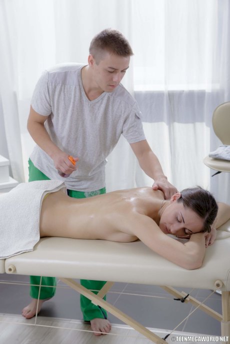 Hot amateur teen Adell gets her oiled ass fucked & jizzed on a massage table