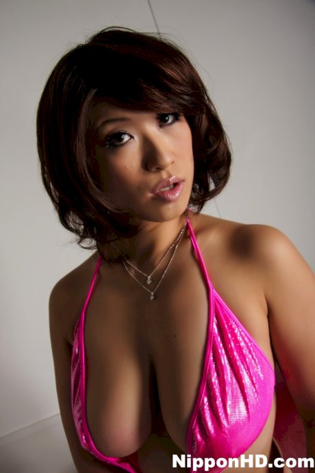 Japanese woman model lets a breast slip free while modeling swimwear