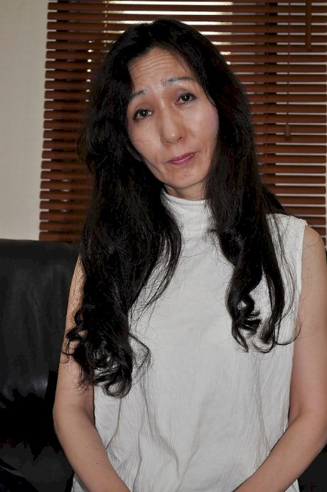 Asian mature lassie Nobue Toyoshima stripping and teasing her hairy twat