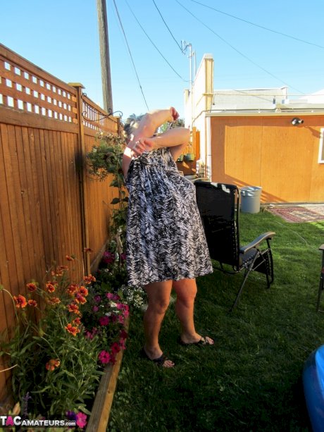 Fatty mature granny Girdle Goddess peels to enjoy wading pool skinny dip