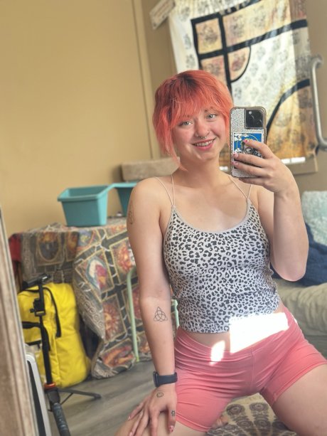 Pink-haired amateur slut Redhead Abby poses dressed up in the mirror