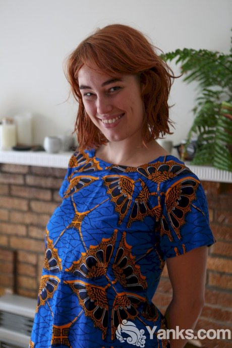Redhead Molly Broad exposes her pink nipples on way to showing her hairy body