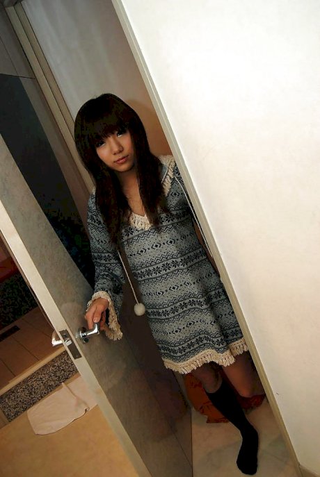 Lovely asian cutie Megumi Kitigawa undressing and spreading her sexy legs