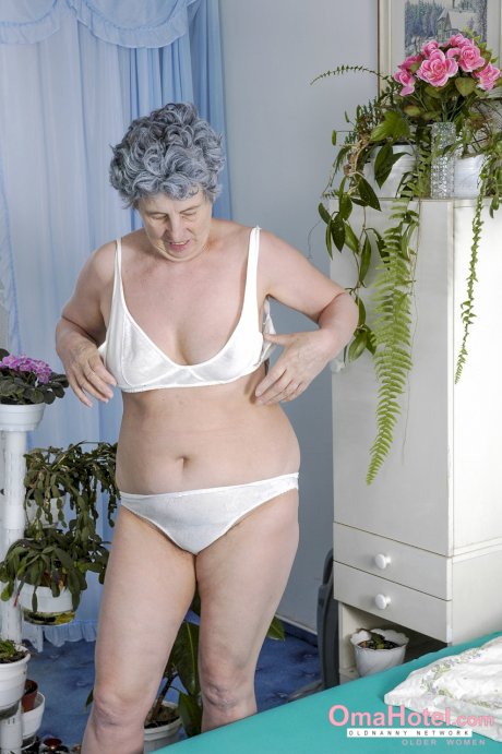 Chubby granny presents her natural tits and toys her hairy vagina with a vase