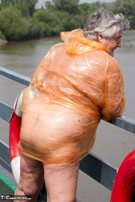 Obese oma Grandma Libby doffs a see-through raincoat to get naked on a bridge