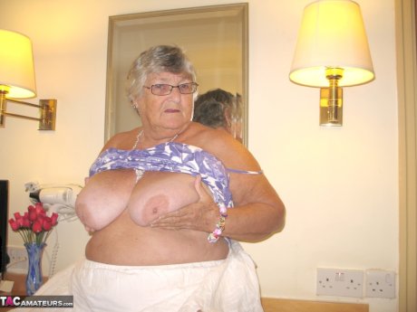 Fat British nan Grandma Libby completely disrobes while in a hotel room