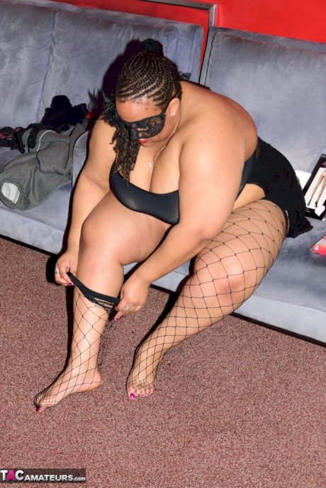SSBBW wears a mask while unveiling her huge saggy tits and massive ass