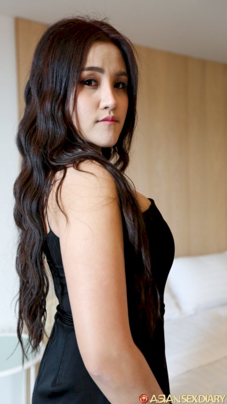 Beautiful Asian girl Zin shows her big tits while undressing for POV sex