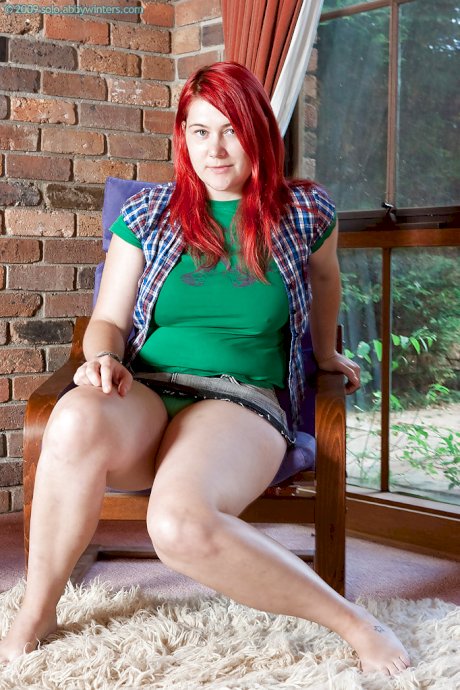 Chubby redhead teen Adalin shows off her puffy hairy pussy and fat butt