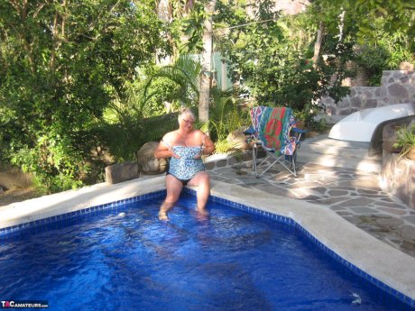 Fat nan Girdle Goddess goes for a skinny dip in a backyard pool