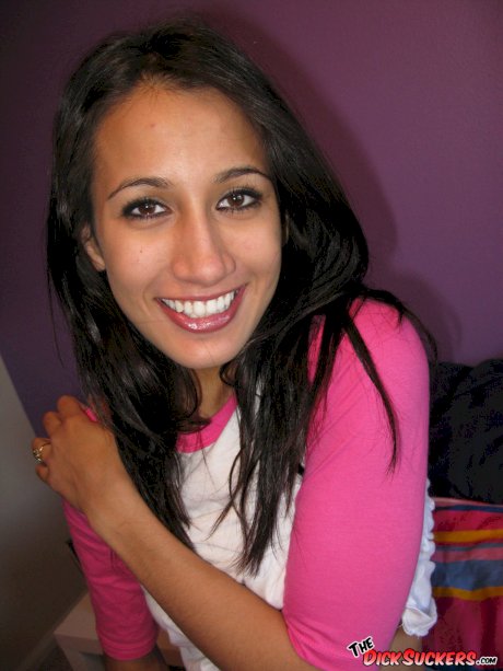 Slim Latina girl Amia Moretti disrobes to leg warmers and sneakers on her bed