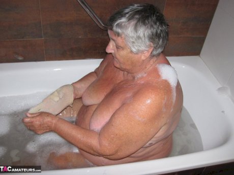 Morbidly obese woman Grandma Libby shaves before taking a bubble bath