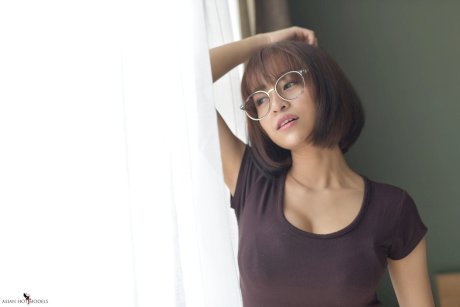 Pretty Asian teen flaunts her hot ass wearing a miniskirt and panties
