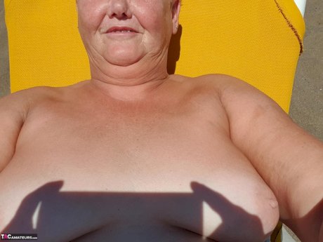 Old SSBBW Val Gasmic dyes her hair red before exposing herself on the beach