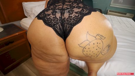 SSBBW Strawberrys Delight shows her massive ass in black lingerie