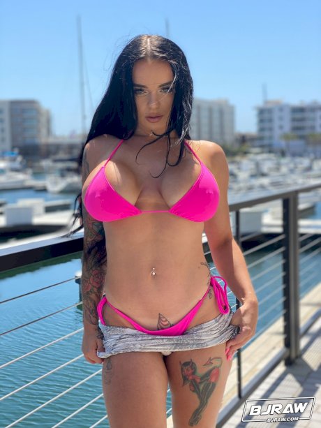 Curvaceous stunner Payton Preslee flaunting her huge melons in a pink bikini