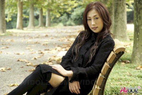 Fully clothed Japanese teen models in the park in black clothes and stockings