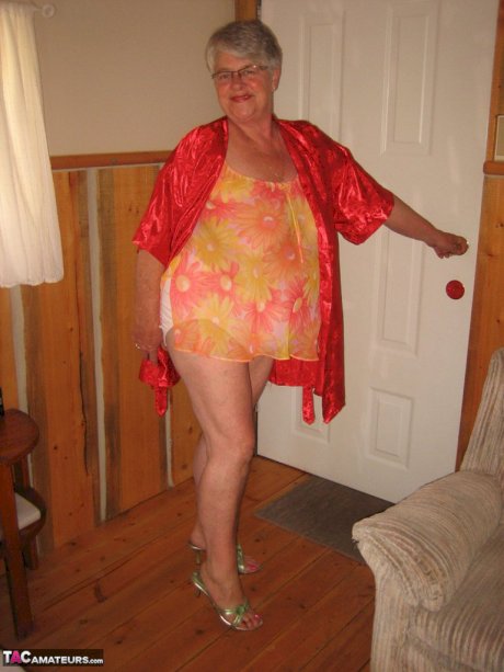 Obese granny Girdle Goddess wakes up from a nap and precedes to strip naked