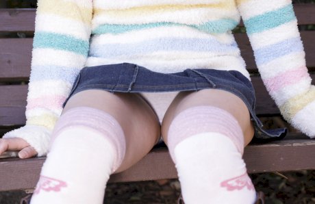 Young looking Asian girl Masami Kanno lifts up her sweater to expose herself