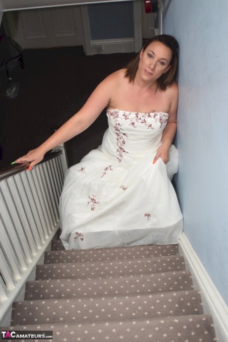 Amateur woman Sara Banks as her tits and pussy freed from a gown by two men