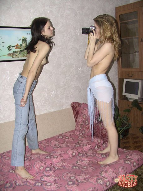 Four playful amateur teens pose provocatively as they strip down naked