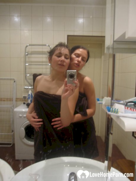 Hot amateur lesbians strip and make out while taking selfies in the bathroom