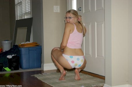 Young blonde girl Tiffany models non nude in cute underwear and glasses
