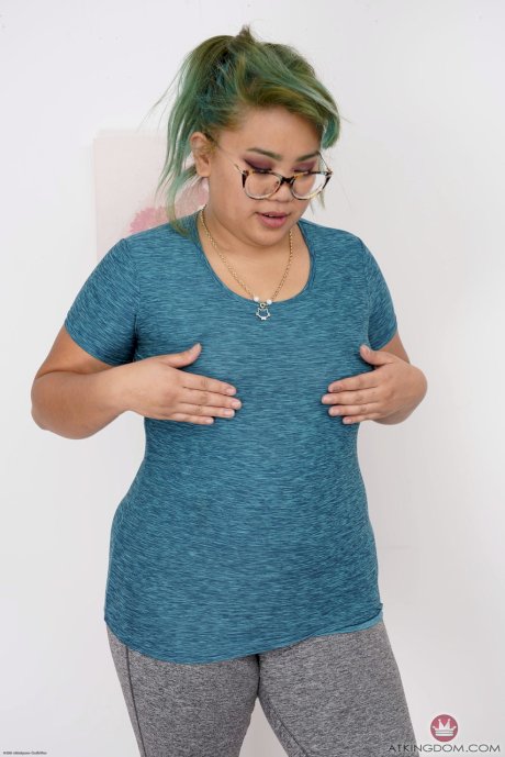 Chubby Asian babe Manila Bey unveils her big saggy tits and huge ass