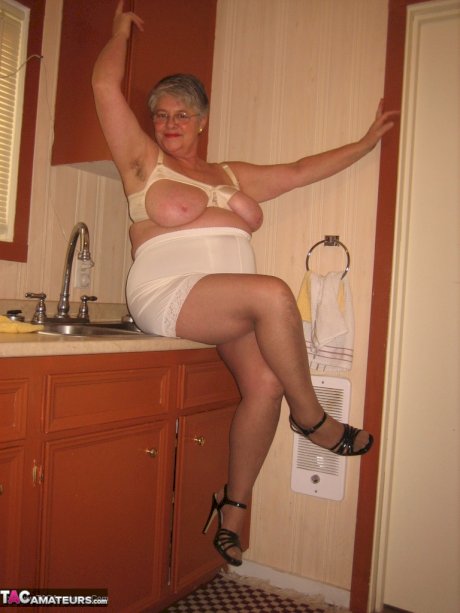 Old woman Girdle Goddess strips to pantyhose in her kitchen