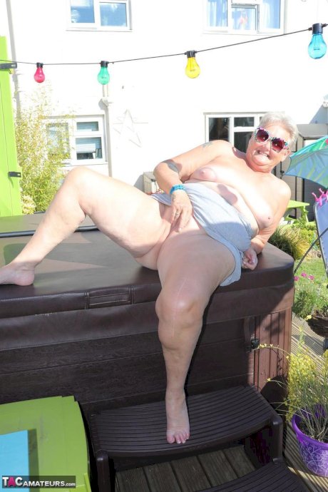 Fat nan Valgasmic Exposed licks a shoe while exposing herself in the backyard