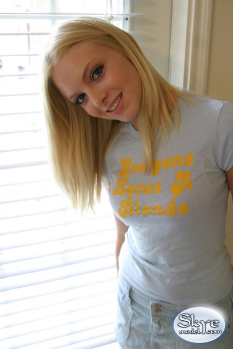 Blonde amateur Skye Model models by herself in a short skirt