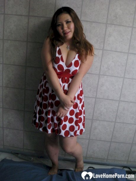 Chubby Asian exposes her huge juggs and massive ass in amateur action