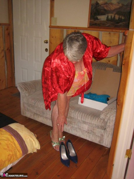 Obese granny Girdle Goddess wakes up from a nap and precedes to strip naked
